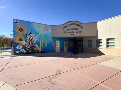 DIA — school entrance with exterior mural and building signage