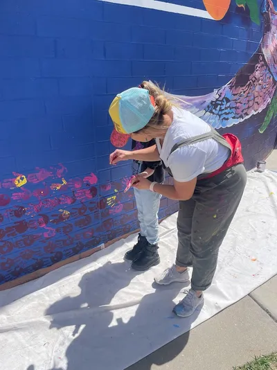 Mesa View Elementary mural — monarch butterfly with student and staff handprints