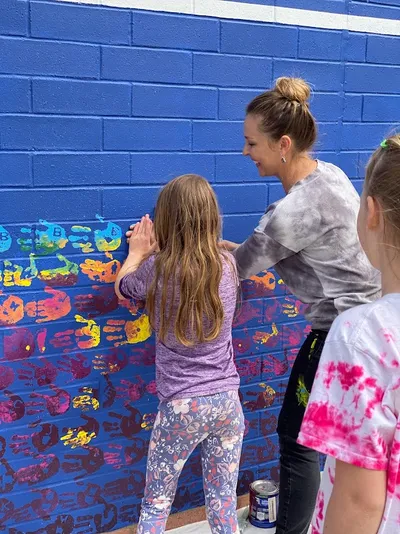 Mesa View Elementary mural — student handprints, green spectrum