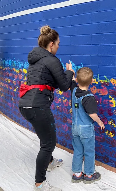 Mesa View Elementary mural — student handprints, indigo spectrum