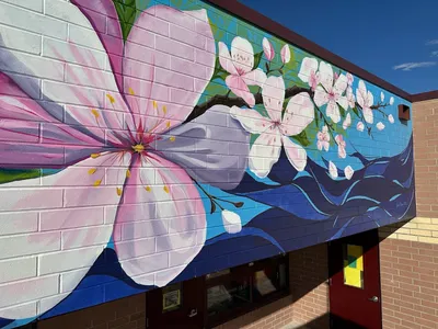 Rocky Mountain Elementary mural, peach blossom detail above a school entrance